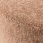 Grand pouf rond en tissu rose poudré