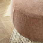 Grand pouf rond en tissu rose poudré