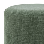 Pouf rond en tissu vert mousse