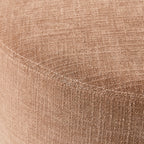Petit pouf rond en tissu rose poudré